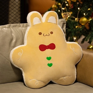 Close-up of ginger bunny plush pillow with red bow and heart buttons for Christmas decor