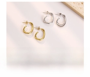 Detailed view of C-shaped titanium steel hoop earrings with vacuum plating finish