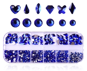 Detailed view of 12-slot storage box with assorted dark blue flatback nail rhinestones
