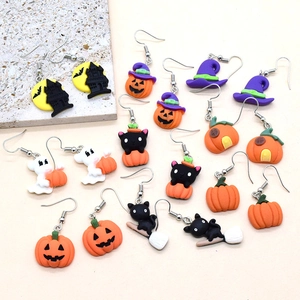 Detailed close-up of colorful Halloween resin earrings featuring pumpkin and ghost designs