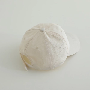 Detail view of breathable side vents and adjustable strap on children's puppy baseball cap