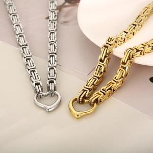 Detail of square Byzantine chain set with heart pendants in gold and silver finish