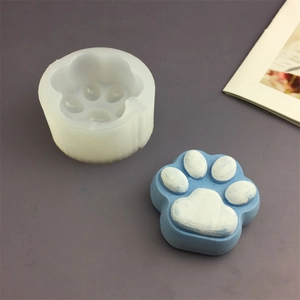 Cat paw silicone mold for chocolate and pudding with a blue finished cat paw resin piece