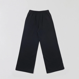 Macro detail of high-quality black cotton wide-leg joggers with elastic waistband