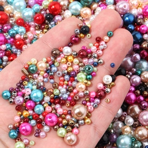 Macro detail of colorful mixed size ABS faux pearls for DIY jewelry and crafts