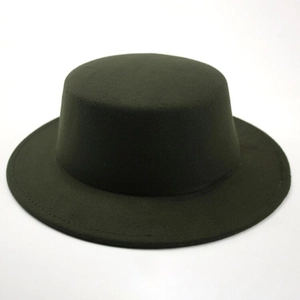 Close-up detail of a vintage dark wool felt flat top boater hat with a wide brim design