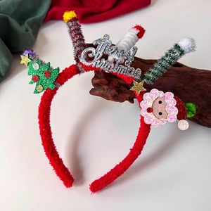 Detail of Christmas headband with plush red band, mini tree, and Merry Christmas glitter text