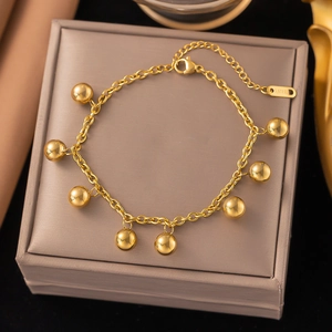 Golden stainless steel chain bracelet with polished sphere charms and adjustable lobster clasp