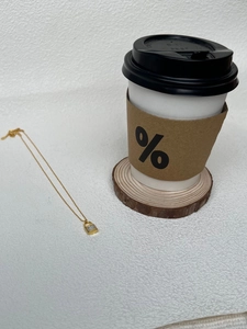 Minimalist gold lock pendant necklace with white shell inlay on a slim silver chain