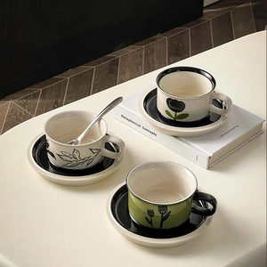 Top view of vintage ceramic coffee cup and saucer sets with hand-painted floral patterns