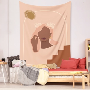 Detail of Bohemian tapestry with abstract female portrait on warm bedroom wall