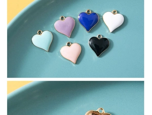 Colorful enamel heart pendants in various shades with gold metal backing and plating