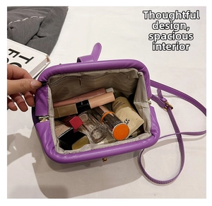 Interior view of purple ruched dumpling bag showing spacious capacity for cosmetics