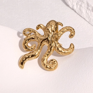 Artistic 18k gold plated octopus ring featuring detailed suction cup textures and unique design