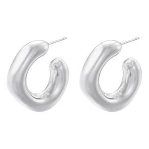 Macro detail of chunky silver C-shaped hoop earrings with a mirror-polished finish