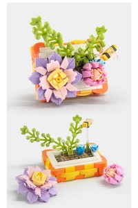 Close-up of DIY building block lily bonsai with purple flowers and a small toy bee detail