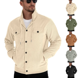 Close-up of ribbed corduroy fabric texture and functional pocket detail on the jacket