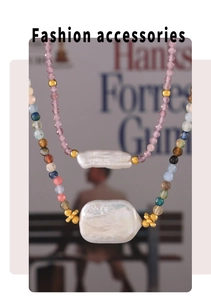 Detailed macro shot of baroque freshwater pearls and multi-colored gemstone necklaces