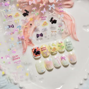 Cute nail art stickers with pastel bow, bunny, and cake designs on a decorative tray