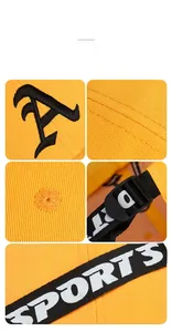 Detail view of yellow baseball cap with Gothic A embroidery and sports ribbon strap
