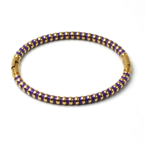 Detail view of 5mm gold stainless steel bangle with purple enamel stripes and buckle