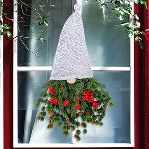 Christmas gnome wreath with pine needles, red berries and pine cones for door hanging