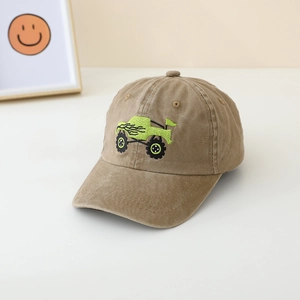 Close-up of green monster truck embroidery on durable khaki kids baseball mesh cap