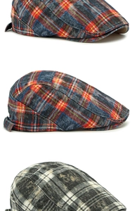 Vertical view of vintage plaid berets with distressed cotton fabric and metal side buckles