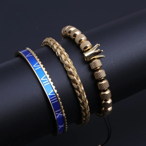 Detailed set of gold and blue titanium steel bracelets with Roman numerals and crown