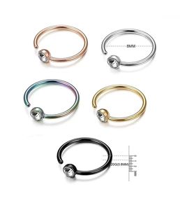 Detail of 20G 8mm stainless steel C-shaped nose rings with sparkling crystal stones