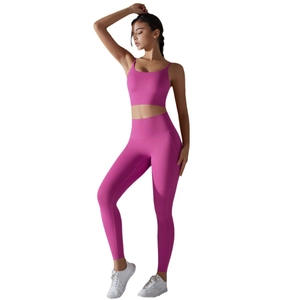 Two-piece hot pink yoga set featuring a U-neck crop top and high waist leggings for fitness
