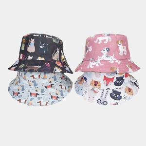 Detailed grid of reversible bucket hats featuring cartoon animal prints and reinforced stitching