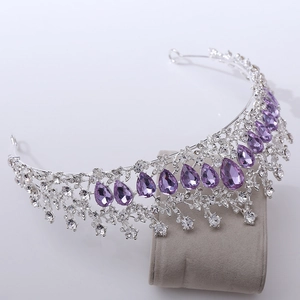 Detail of luxury bridal tiara with sparkling purple crystals and clear rhinestones