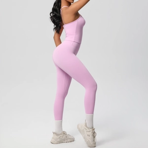Close-up of pink yoga set featuring slim straps tank top and high waist leggings