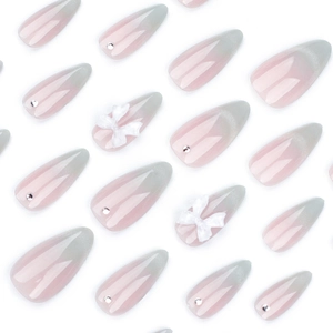 Cat eye cat-eye press-on nails with 3D white bow and rhinestone almond shaped nails