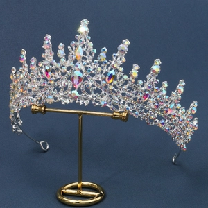 Close-up of luxury bridal crown with iridescent rhinestones and large pear-shaped crystals