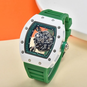 Detail of tonneau-shaped skeleton watch with white case and green rubber strap