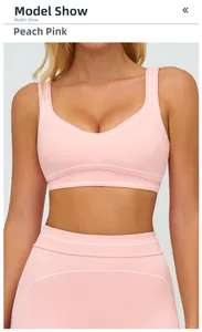Detail of peach pink yoga sports bra with elastic fabric and white stripe trim details