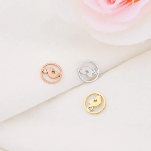 Three stainless steel hollow paw print pendants with rhinestones in gold, silver, rose gold