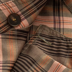 Women's plaid shirt jacket featuring vintage brown and pink checks with button detail