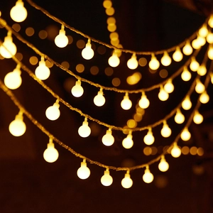 Warm white LED string lights with round bulbs on hemp rope for outdoor camping decor