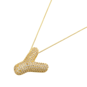 Detail of 18K gold-plated balloon letter V pendant with cubic zirconia on box chain