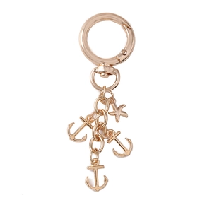 Rose gold alloy keychain featuring creative starfish and four anchor charms on spring ring
