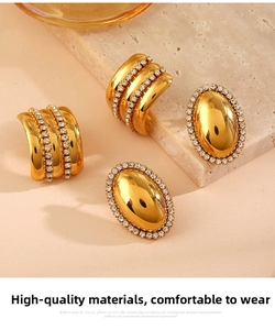 Detail of vintage gold-plated stainless steel earrings with sparkling zircon inlay