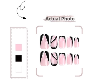 Detail of medium-long press-on nails with pink and black geometric pattern designs