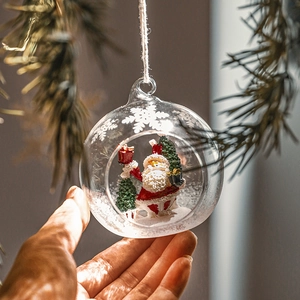 Christmas glass hanging ornament with resin Santa inside for festive tree decoration