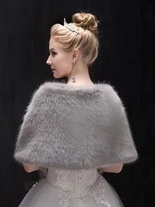 Detail view of the soft grey faux fur texture on bridal shawl with a high-end back profile