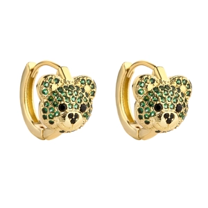 Cute teddy bear huggie earrings with green crystals and gold plating on white background
