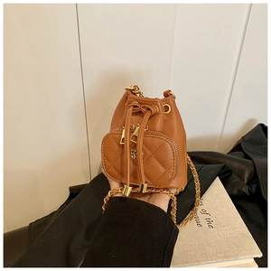 Brown mini camellia bucket bag with gold chain strap and quilted drawstring pocket