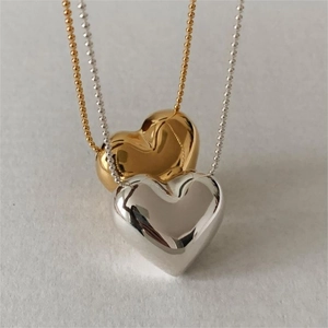 Minimalist 925 sterling silver heart necklaces in polished gold and silver finishes